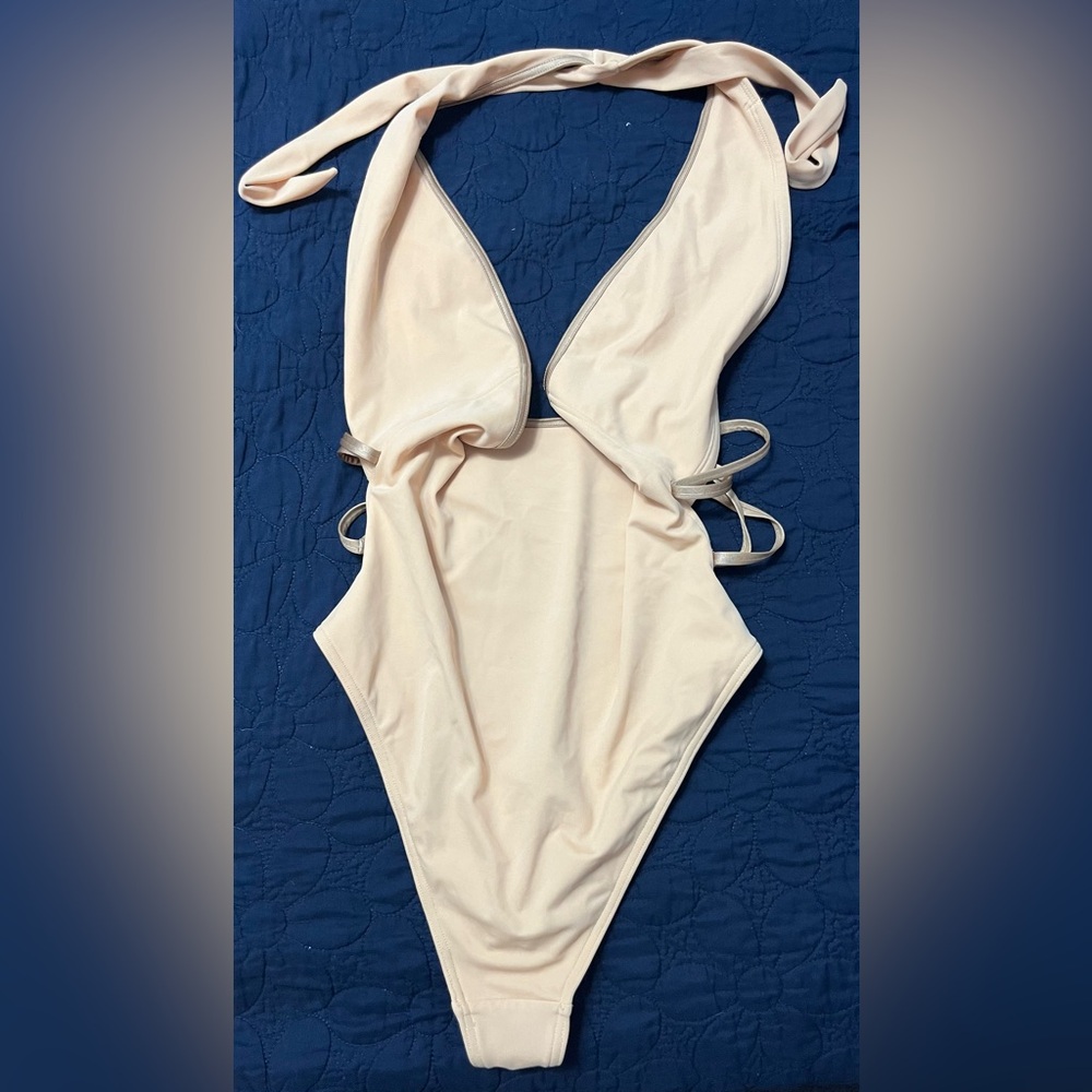 NWOT women’s ASOS one piece halter swimsuit. Color is light peach size 10.